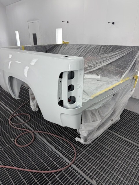 The Sierra's bed masked and refinished in the spray booth