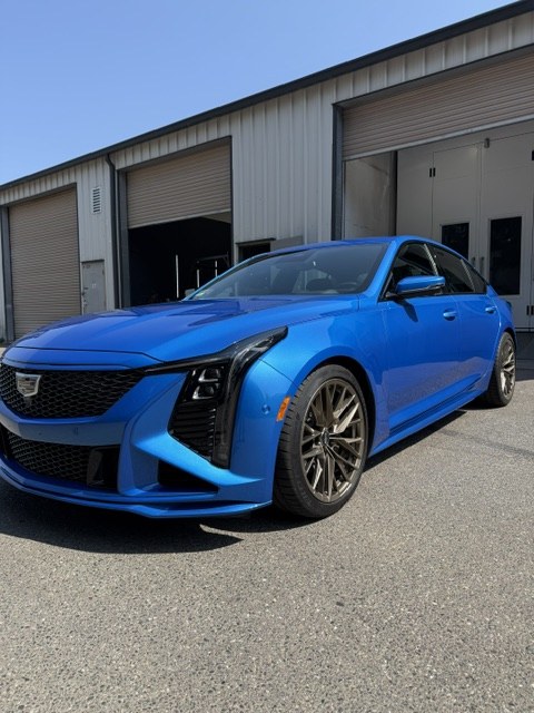 Blue Cadillac CT5-V Blackwing with customized accents, front three-quarter view