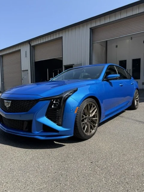 Blue Cadillac CT5-V Blackwing with customized accents, front three-quarter view