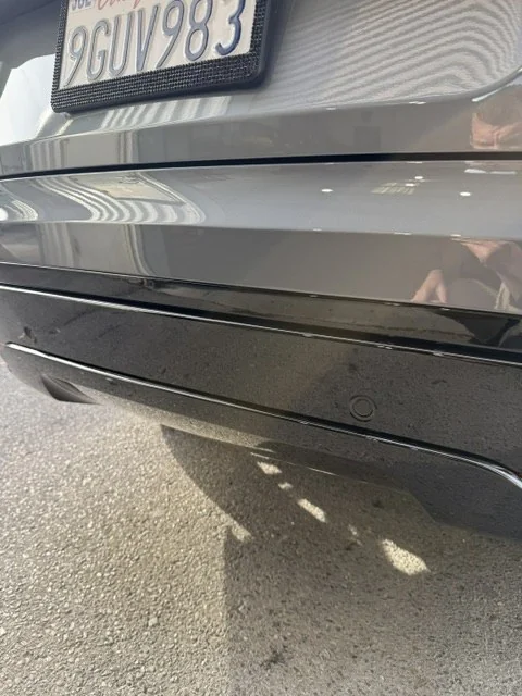 Close view of the repaired rear bumper panel gaps on the 2024 Range Rover
