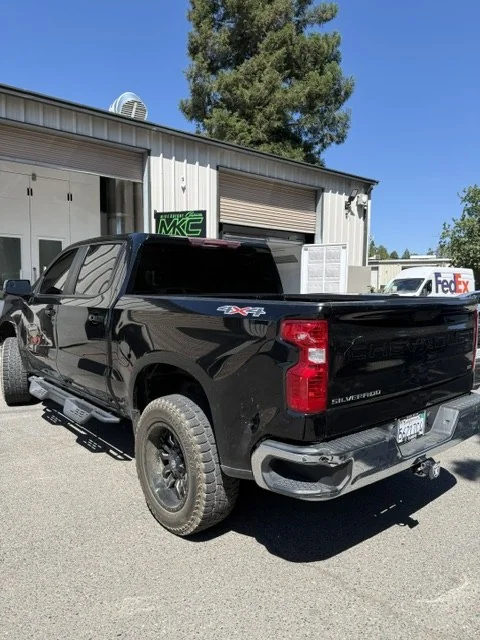 Rear three-quarter view of the finished Silverado at the shop