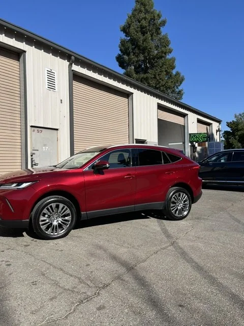 2024 Toyota Venza in deep candy red outside the shop after a four-stage refinish