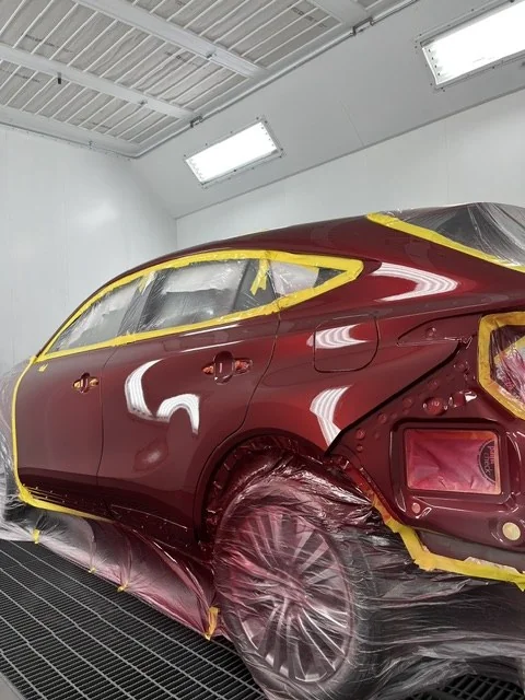 The Venza masked and staged in the spray booth mid-refinish